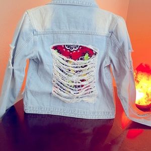 Unisex denim jacket with custom peek-a-boo interior. Size medium runs small.